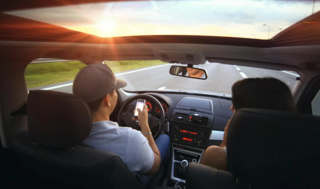 Motorist texting while driving.